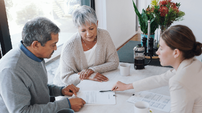 Estate planning attorney Grand Rapids MI meeting with a family about wills and trusts